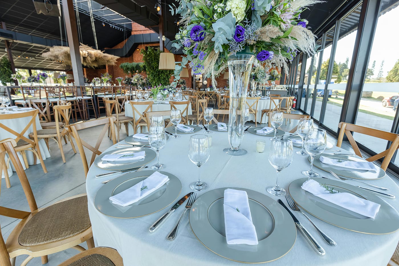 Purple blue and cream corporate flower arrangement